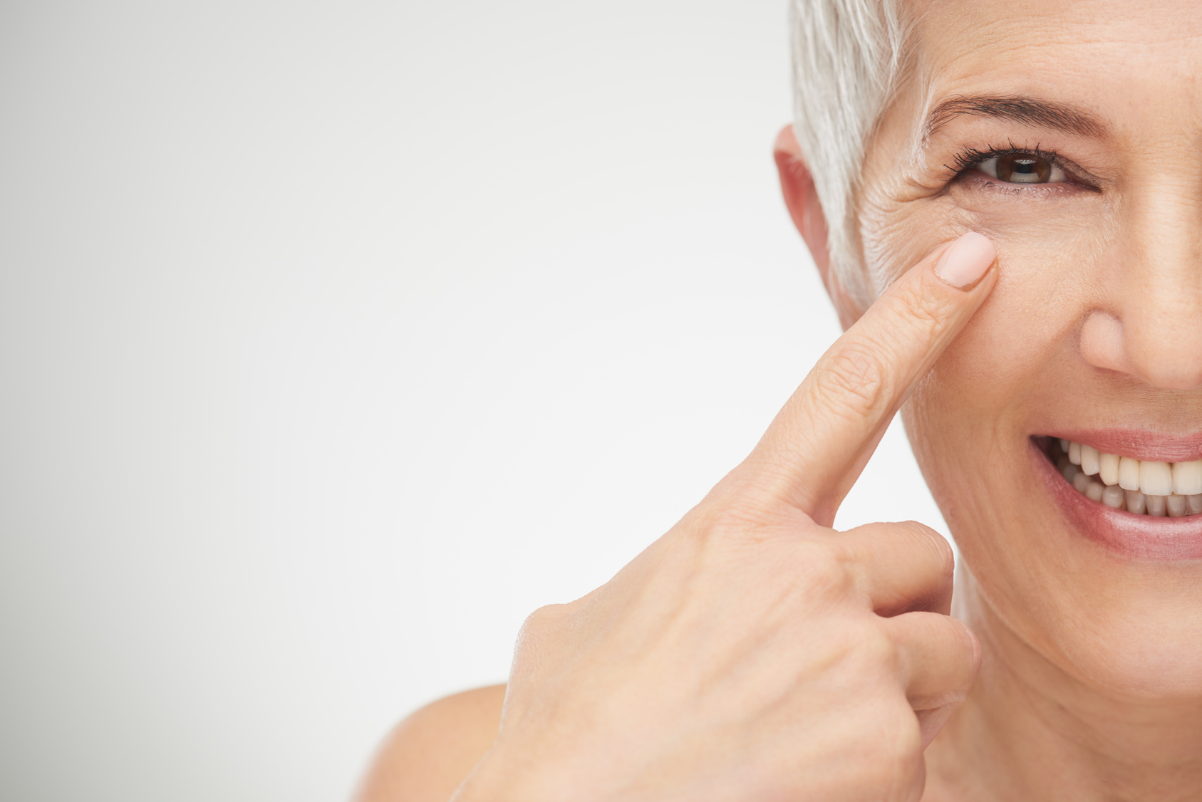 Close up of senior woman showing wrinkles.